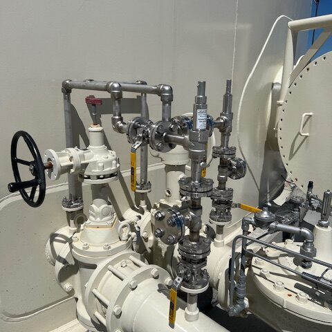 Complex industrial piping system with valves and gauges.